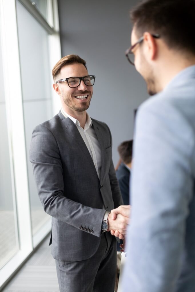 Business people shaking hands, finishing up meeting